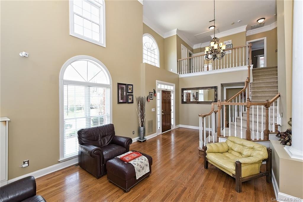 3330 Rhett Butler Place Charlotte, NC 28270 - Photo 8 of 48 a living room with furniture fireplace and a large window