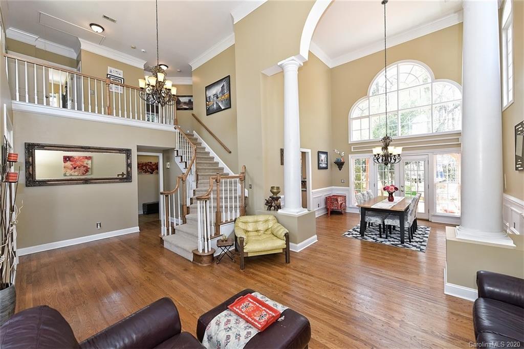 3330 Rhett Butler Place Charlotte, NC 28270 - Photo 10 of 48 a living room with furniture chandelier and a wooden floor
