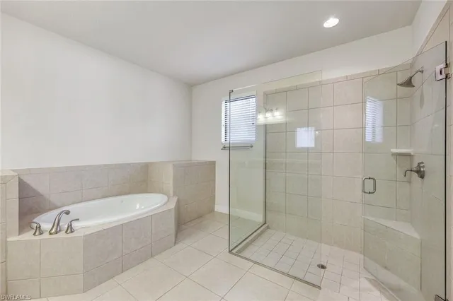 a bathroom with a bathtub and shower