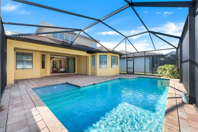 a view of swimming pool with yard