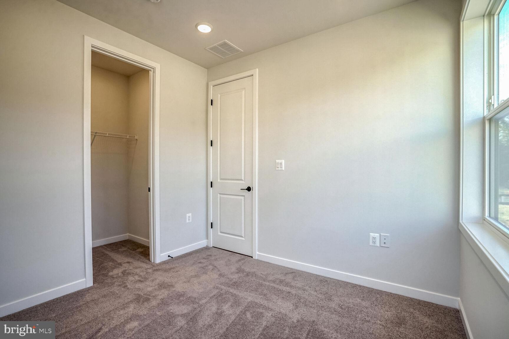 1653 Fellowship Square Reston, VA 20190 - Photo 21 of 26 an empty room with windows and closet