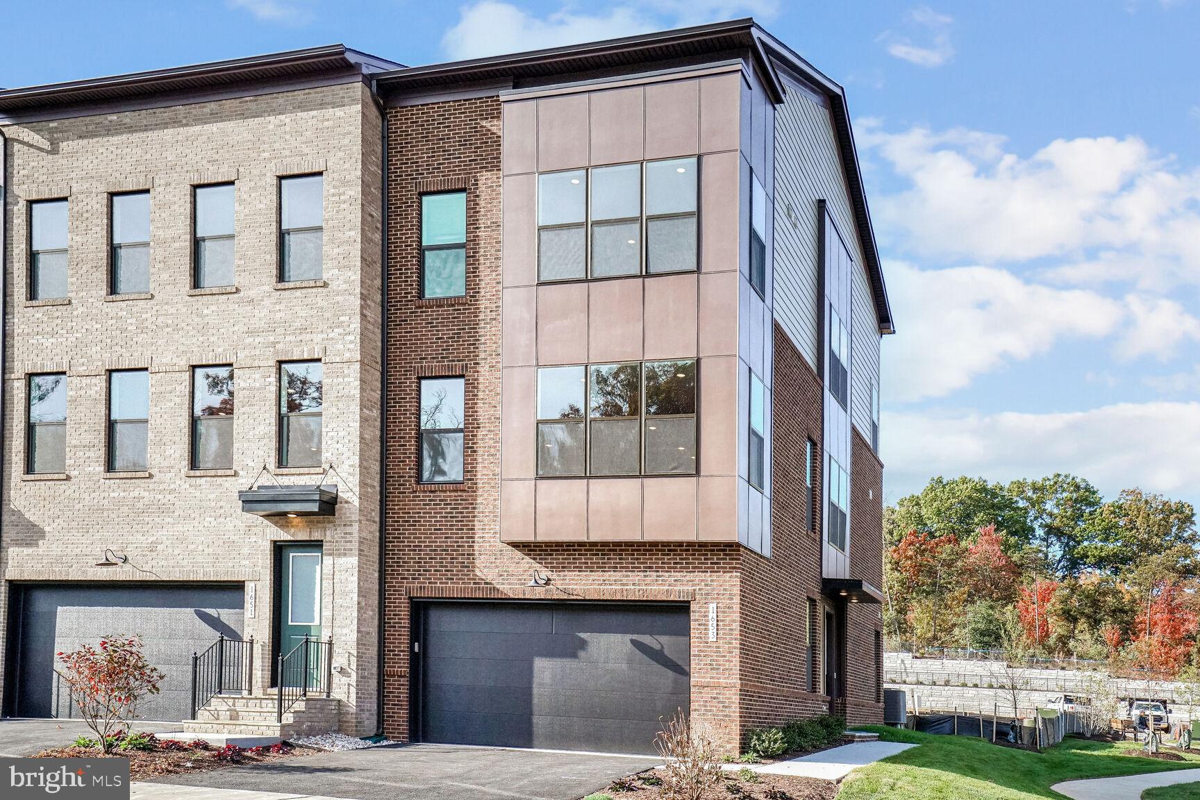 1653 Fellowship Square Reston, VA 20190 - Photo 24 of 26 a front view of a building with a garden and entryway