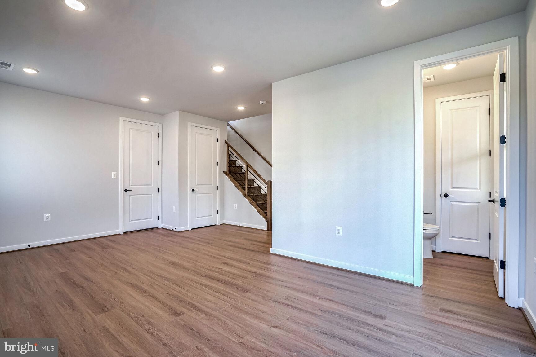 1653 Fellowship Square Reston, VA 20190 - Photo 25 of 26 a view of an empty room with wooden floor and windows
