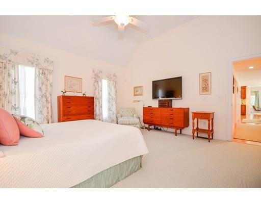 32 Olde Sheepfield Road Marion, MA 02738 - Photo 25 of 41 a bedroom with a bed and flat screen tv