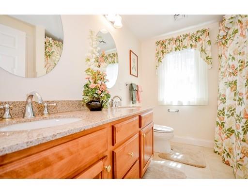 32 Olde Sheepfield Road Marion, MA 02738 - Photo 30 of 41 a bathroom with a granite countertop sink a toilet and a shower curtain