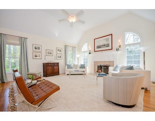 32 Olde Sheepfield Road Marion, MA 02738 - Photo 6 of 41 a living room with furniture a fireplace and a large mirror