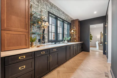 a bathroom with a sink vanity granite and a mirror