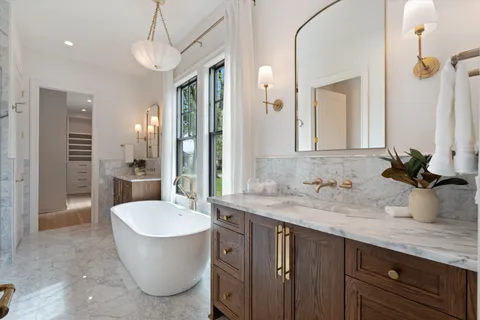 a view of a dining room with furniture wooden floor and chandelier
