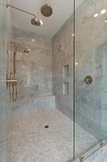 a view of a hallway with workspace and a window