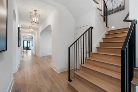 a bathroom with a toilet a sink and shower