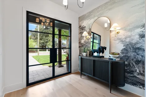 a living room with lots of furniture and a wooden floor