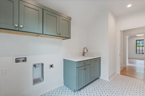 a bathroom with a granite countertop sink a toilet and shower