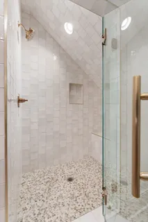 a view of a room with wooden floor and window