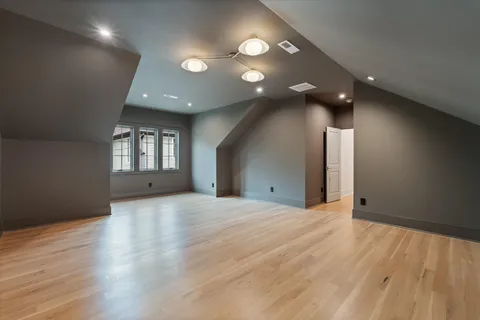 a front view of a house with yard and green space