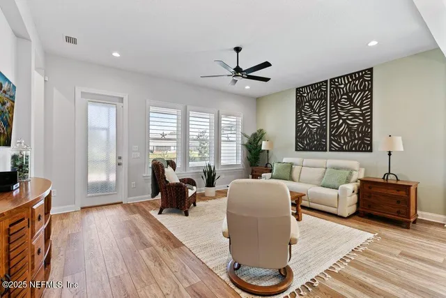 a bathroom with a double vanity sink mirror and shower