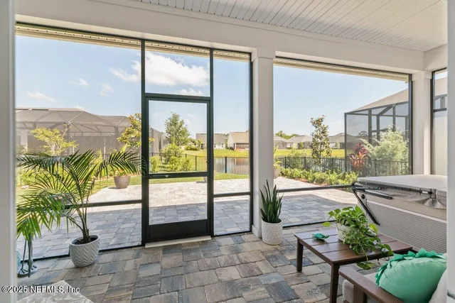 a view of walk in closet and bathroom