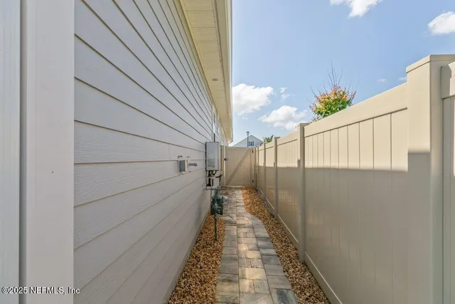 an outdoor space with patio and white umbrellas