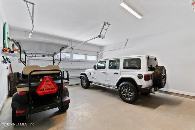 a view of a patio with a table chairs and backyard
