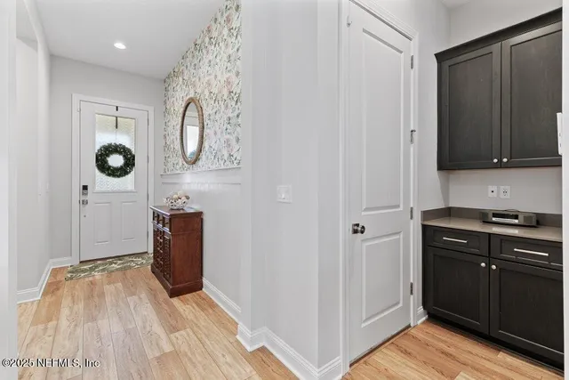 a kitchen with stainless steel appliances a stove sink microwave and cabinets