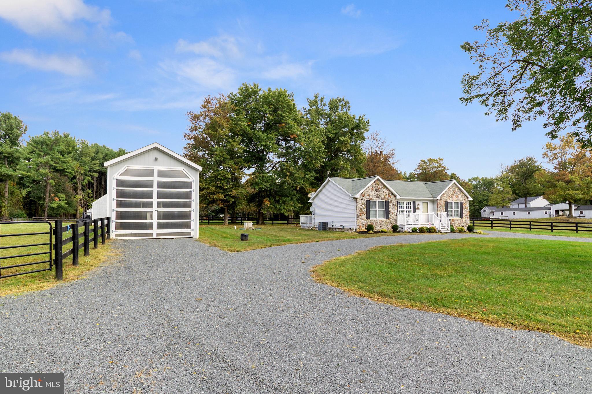 19821 Foggy Bottom Road Bluemont, VA 20135 - Photo 12 of 92 a view of a house with a yard and large trees