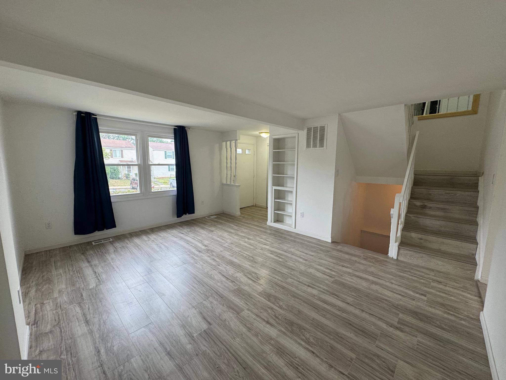 1757 Carriage Way Frederick, MD 21702 - Photo 14 of 42 a view of empty room with wooden floor and window
