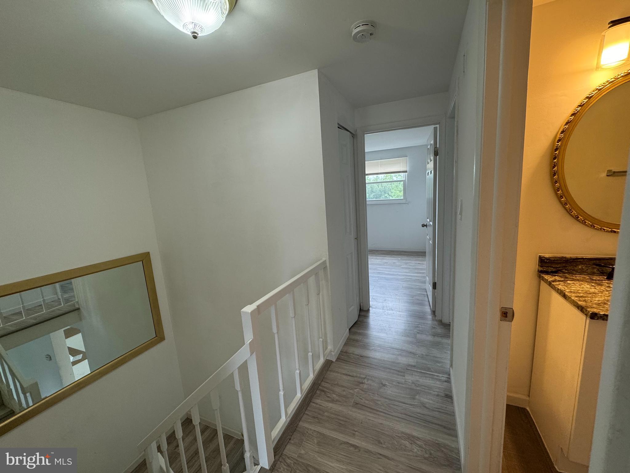 1757 Carriage Way Frederick, MD 21702 - Photo 19 of 42 a view of a hallway with wooden floor