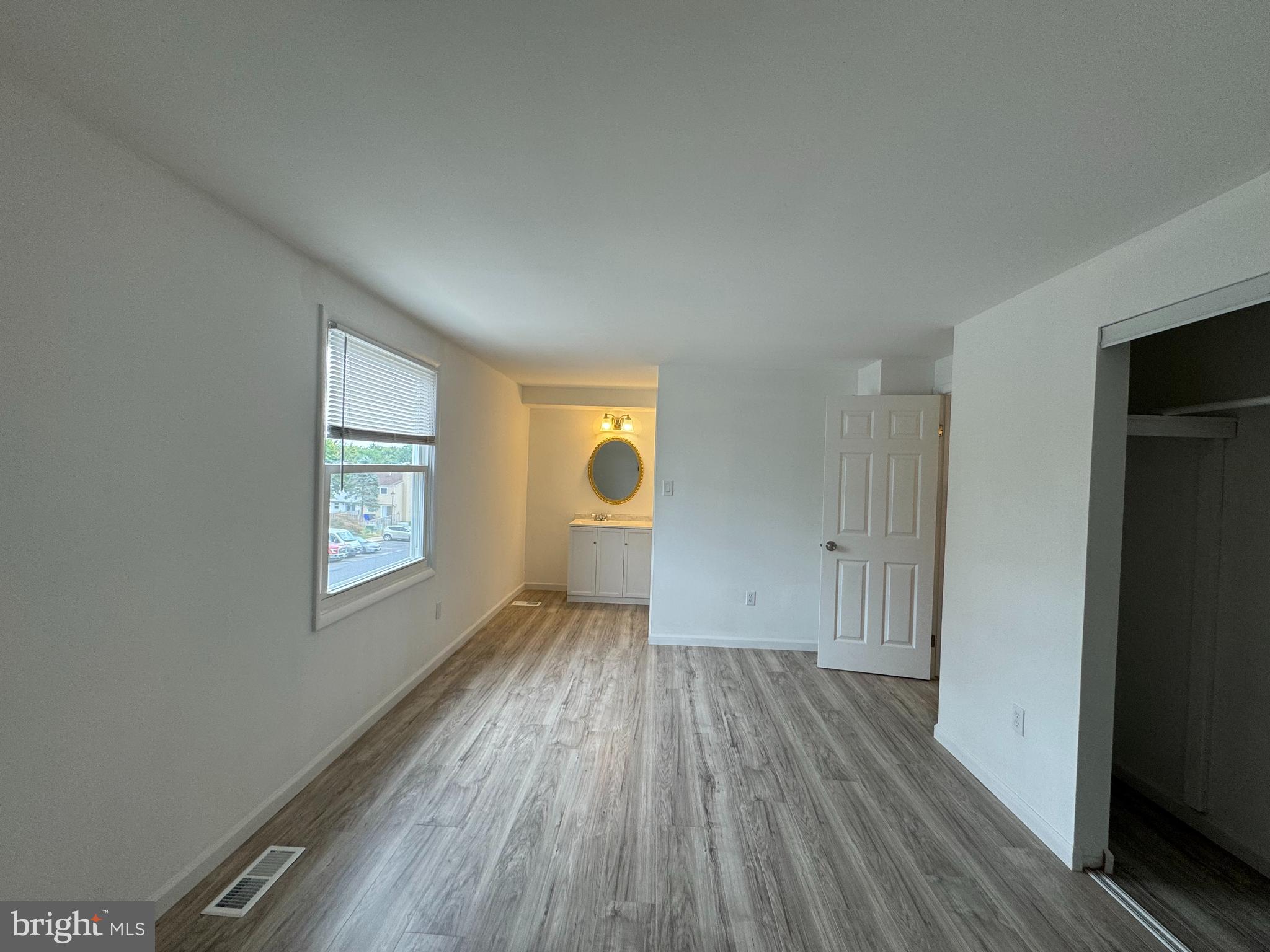 1757 Carriage Way Frederick, MD 21702 - Photo 20 of 42 an empty room with wooden floor and windows