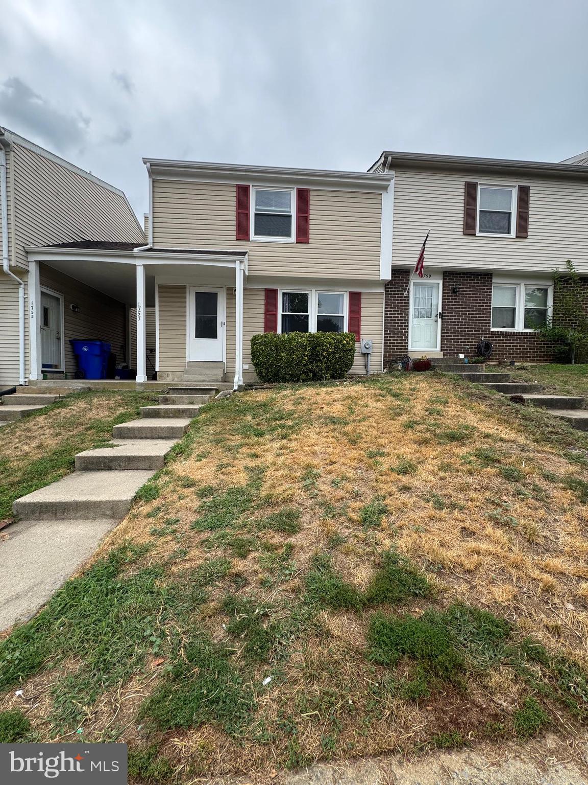 1757 Carriage Way Frederick, MD 21702 - Photo 2 of 42 a front view of a house with a yard