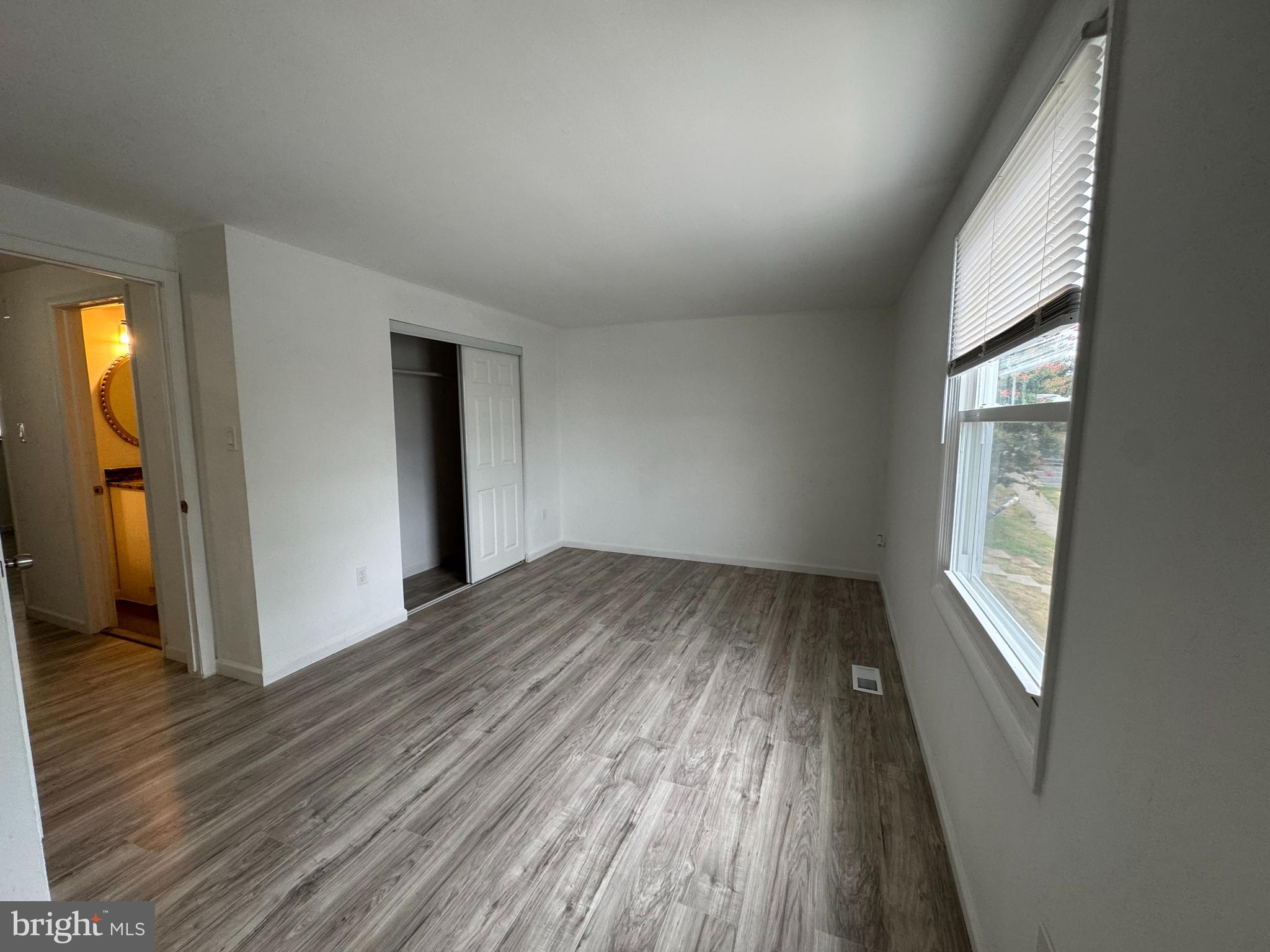 1757 Carriage Way Frederick, MD 21702 - Photo 22 of 42 an empty room with wooden floor and windows
