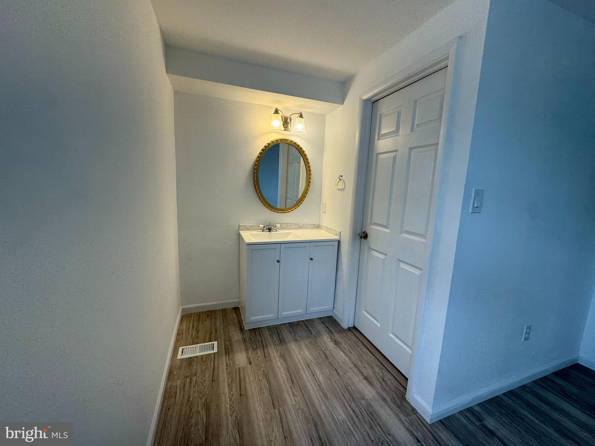 1757 Carriage Way Frederick, MD 21702 - Photo 25 of 42 a view of a bathroom with a sink and a mirror