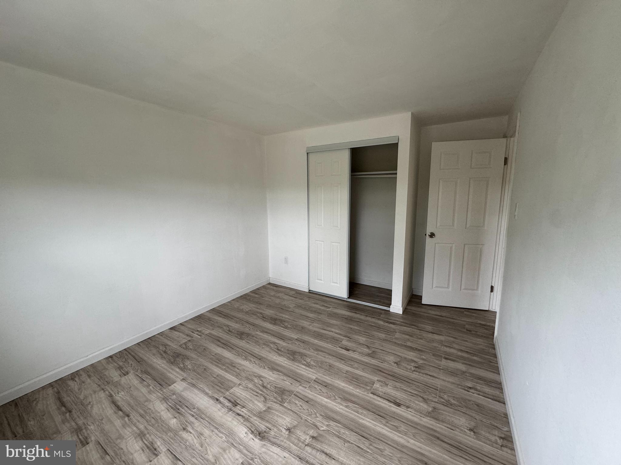 1757 Carriage Way Frederick, MD 21702 - Photo 27 of 42 a view of an empty room with wooden floor