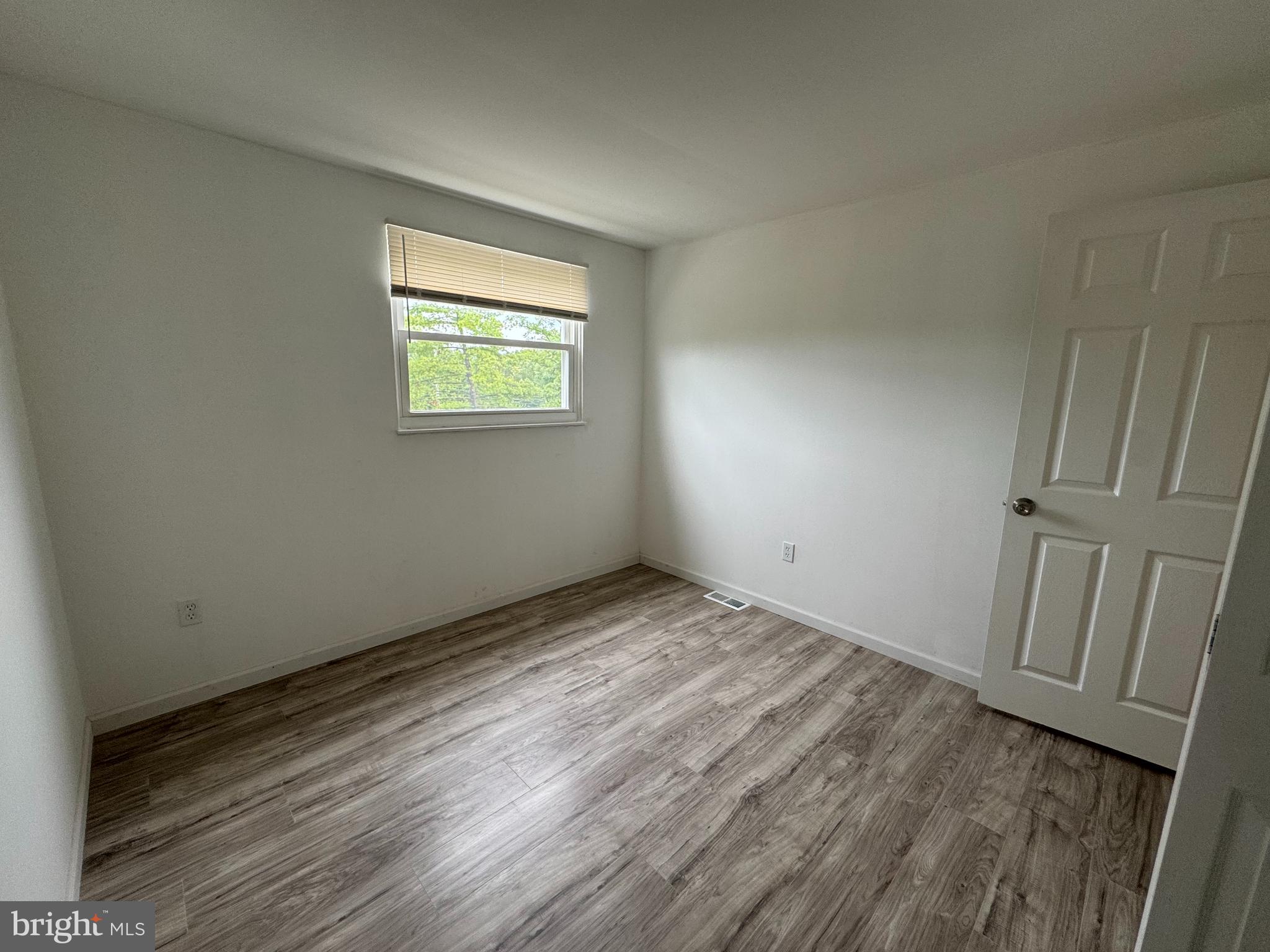 1757 Carriage Way Frederick, MD 21702 - Photo 29 of 42 an empty room with wooden floor and windows