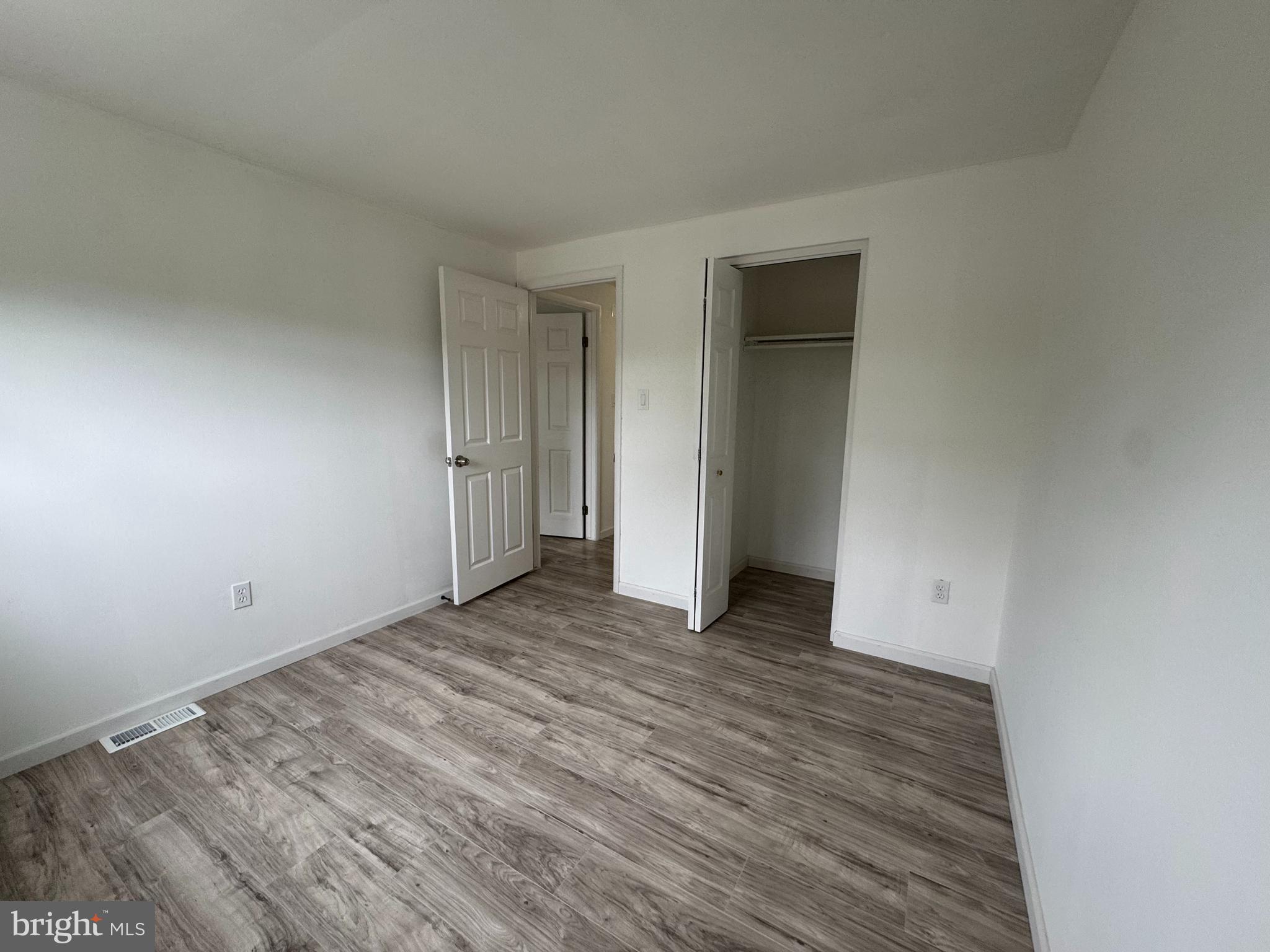 1757 Carriage Way Frederick, MD 21702 - Photo 30 of 42 a view of an empty room with wooden floor