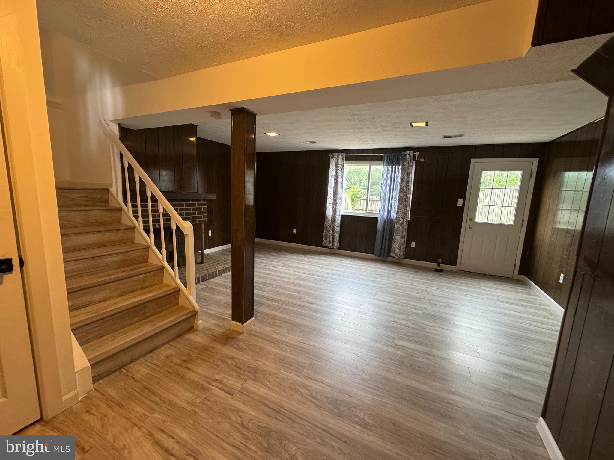 1757 Carriage Way Frederick, MD 21702 - Photo 35 of 42 a view of a room with wooden floor and stairs