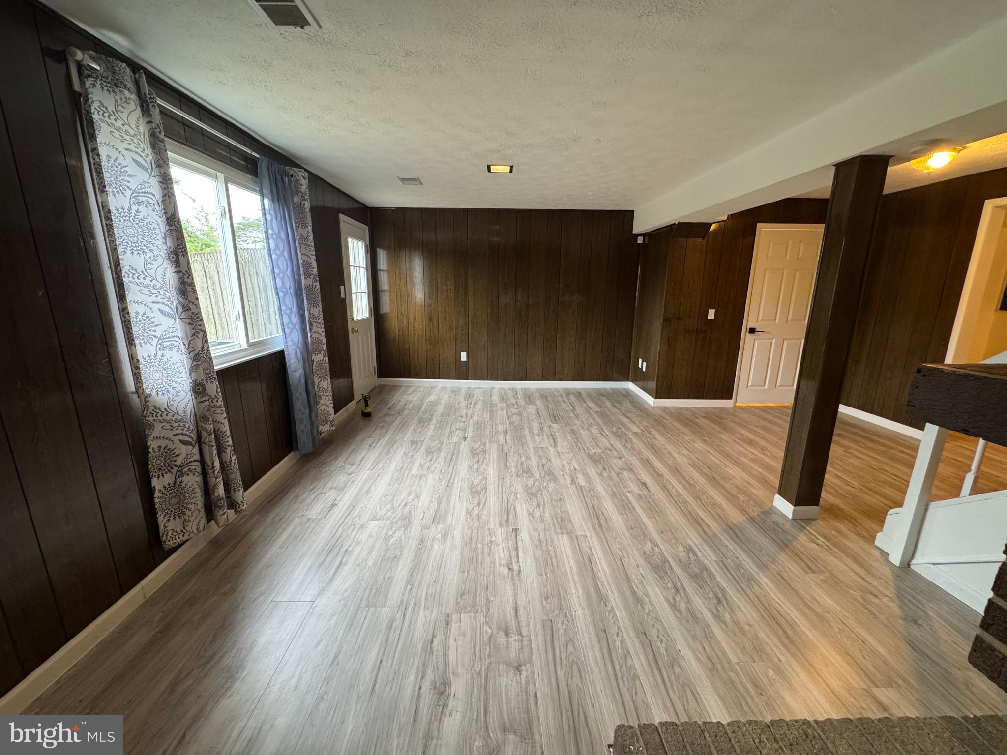 1757 Carriage Way Frederick, MD 21702 - Photo 37 of 42 a view of an empty room with wooden floor and a window
