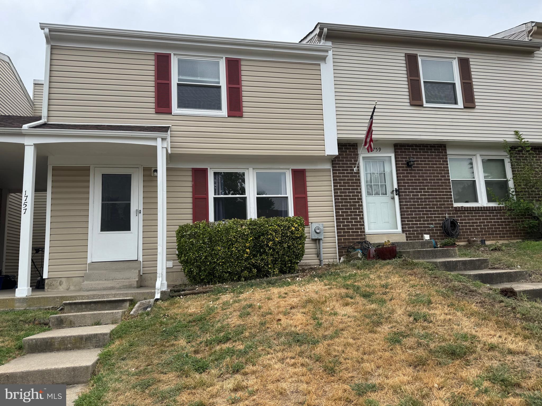 1757 Carriage Way Frederick, MD 21702 - Photo 40 of 42 a front view of a house with a yard