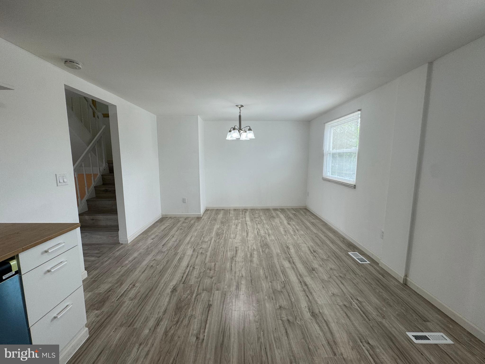 1757 Carriage Way Frederick, MD 21702 - Photo 8 of 42 wooden floor in an empty room with a window