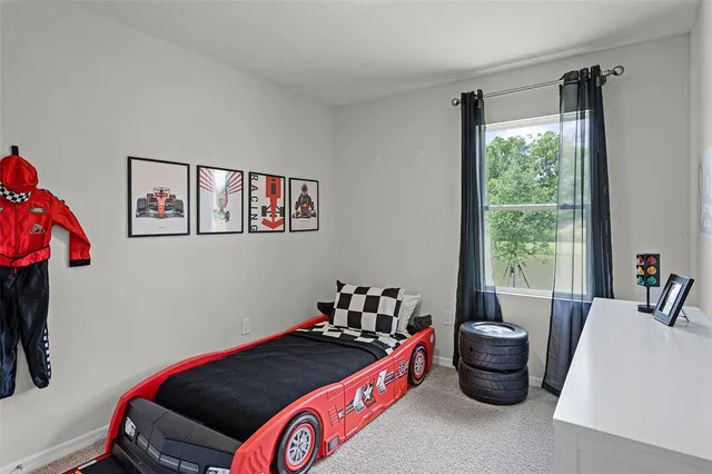 a bed room with furniture and a window