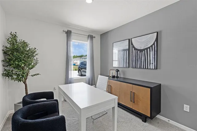 a view of entryway with kitchen island a sink a window and a couch