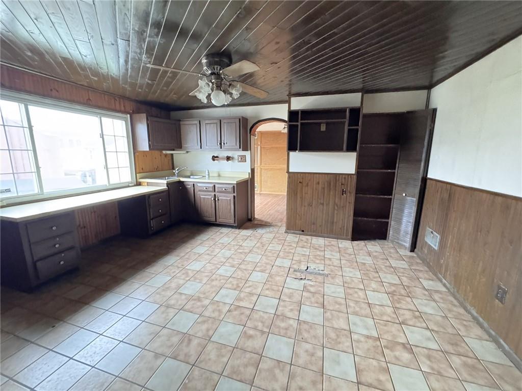 1913 Fox Way Pittsburgh, PA 15203 - Photo 3 of 9 a large white kitchen with a stove a sink dishwasher and a oven