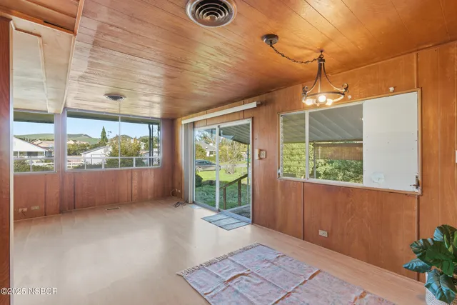 a view of livingroom with furniture and a window