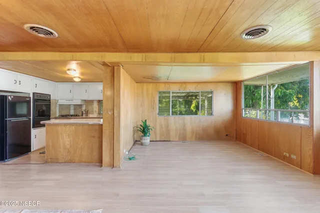 a kitchen with stainless steel appliances granite countertop a sink and cabinets
