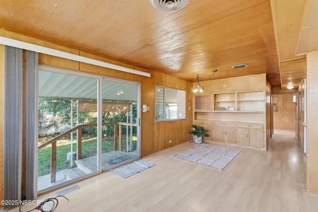 a bedroom with a large window and walk in closet
