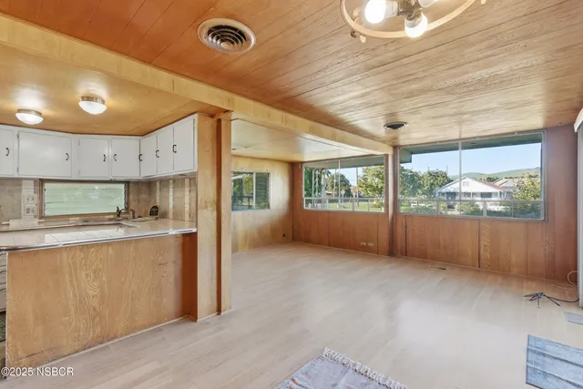 a kitchen with stainless steel appliances granite countertop a stove and a wooden cabinets