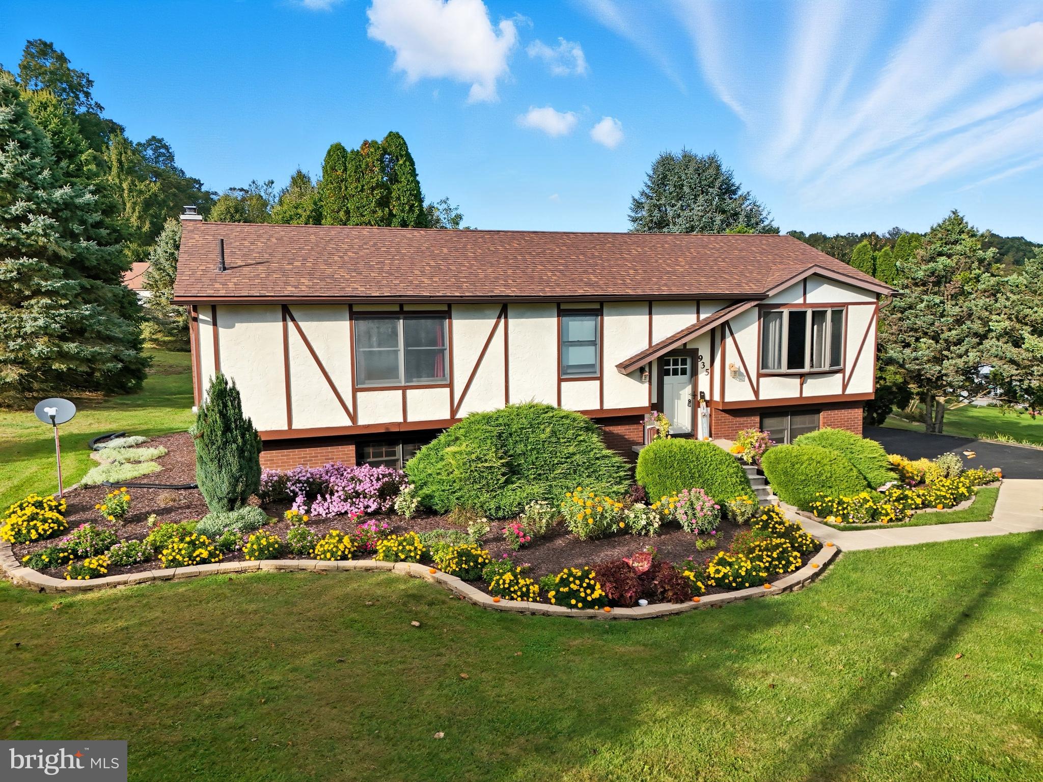 935 Pleasant Grove Road Red Lion, PA 17356 - Photo 1 of 70 a view of a house with a garden and plants