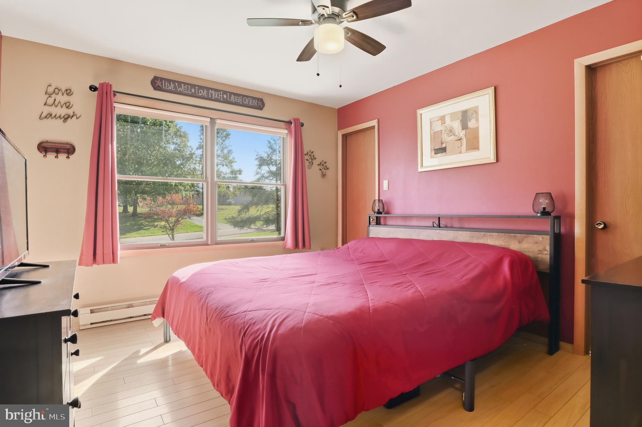 935 Pleasant Grove Road Red Lion, PA 17356 - Photo 21 of 70 a bed sitting in a bedroom next to a window