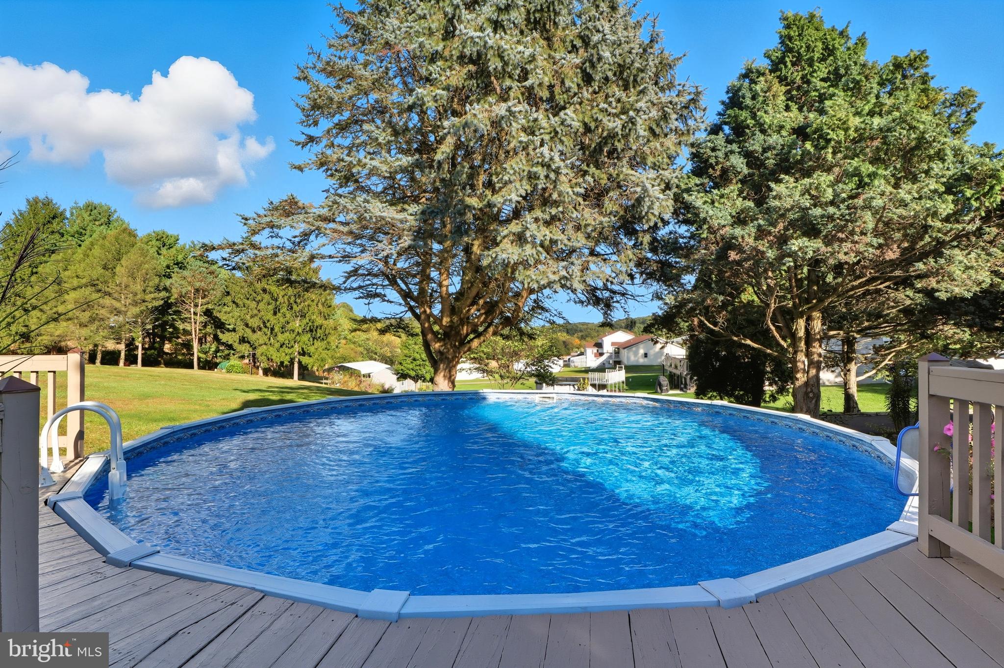 935 Pleasant Grove Road Red Lion, PA 17356 - Photo 40 of 70 a view of outdoor space with swimming pool and trees in the background