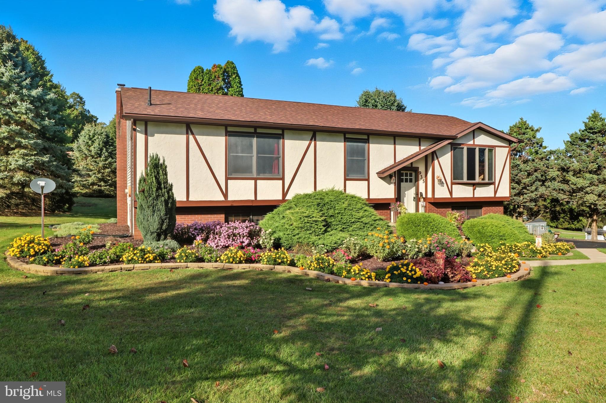 935 Pleasant Grove Road Red Lion, PA 17356 - Photo 47 of 70 a front view of a house with a garden