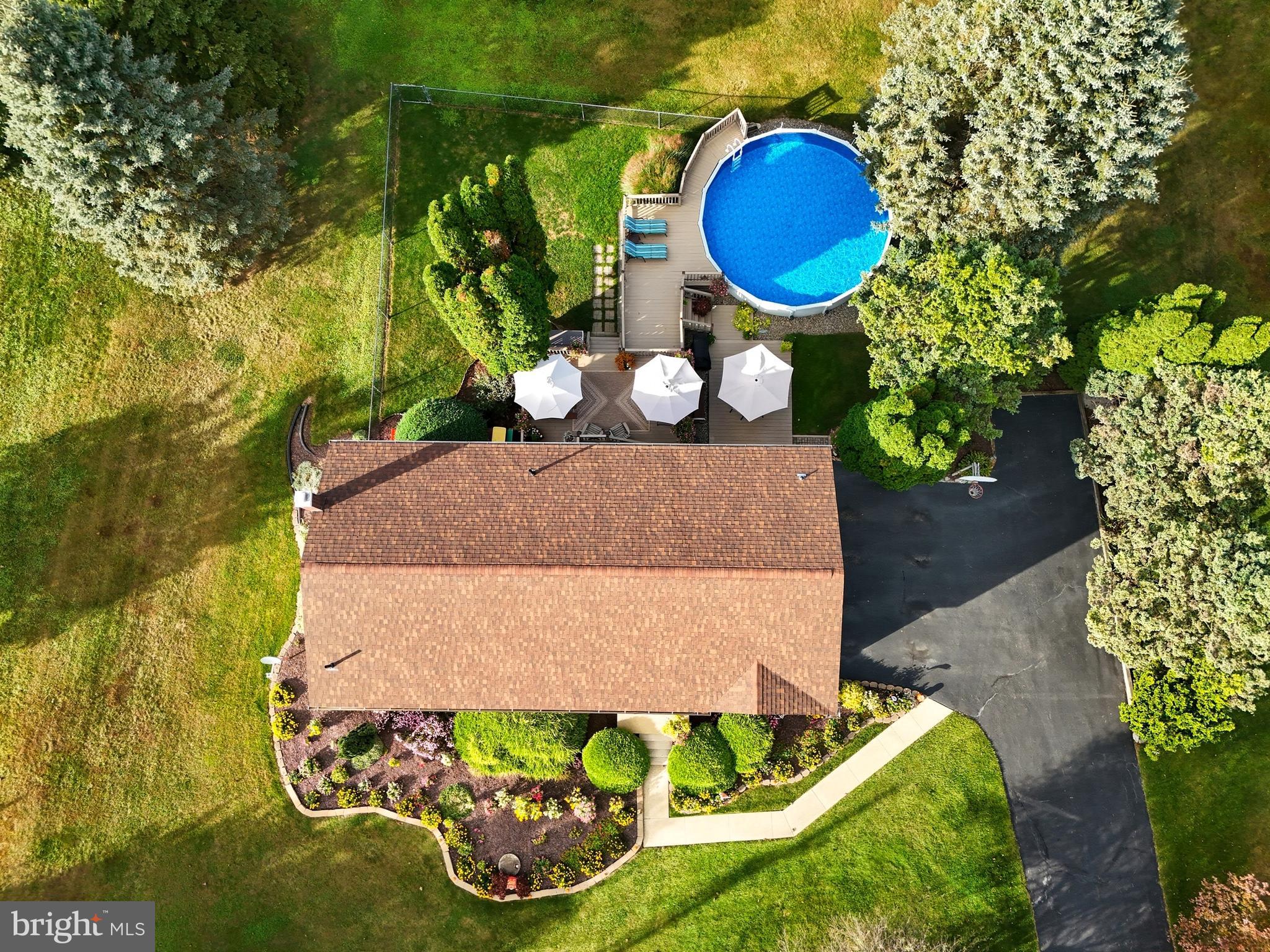 935 Pleasant Grove Road Red Lion, PA 17356 - Photo 64 of 70 an aerial view of a house with a swimming pool a yard and a fountain