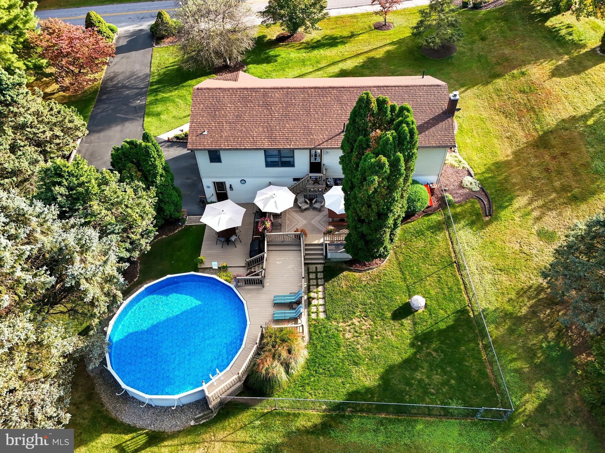 935 Pleasant Grove Road Red Lion, PA 17356 - Photo 67 of 70 a aerial view of a house with swimming pool and garden